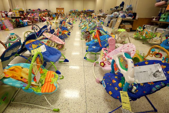 Rows of used bouncy seats for sale.
